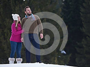 Couple having fun and walking in snow shoes