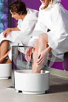Couple having hydrotherapy water footbath
