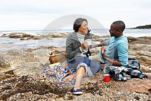 Couple having picnic on beach