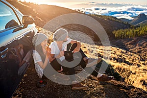 Couple having picnic near the car