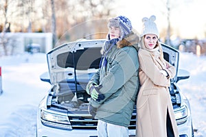 Couple having problem with the car during winter trip