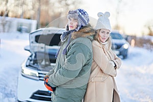 Couple having problem with the car during winter trip