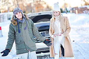 Couple having problem with the car during winter trip