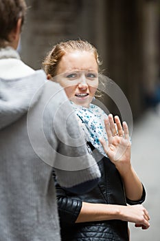 Couple having quarrel on city street