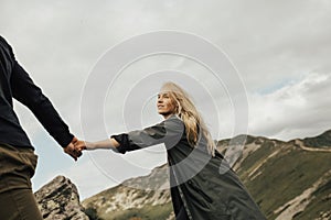 Couple having rest on the top of mountain with view