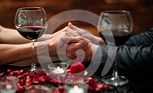 A couple having a romantic dinner in a elegance restaurant with beautiful decoration. Romance and Valentines day concept