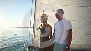 Couple having romantic voyage on the yacht