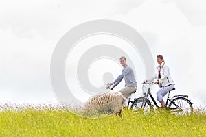 Couple having sea coast bicycle tour at levee