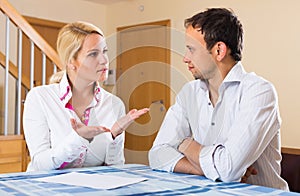 Couple having serious talking at home