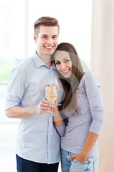 Couple having toast in new home