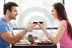 Couple having toast in restaurant