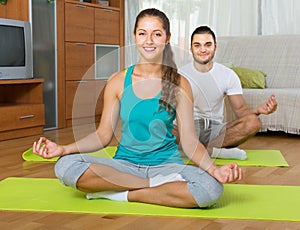 Couple having yoga class