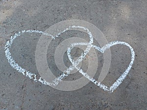 Couple heart drawn with chalk on the asphalt. love confession. banner valentine, children creativity summer