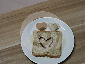 Couple Heart shaped on Whole Wheat Bread put on white tray, background love Valentine Day