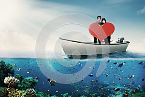 Couple with heart symbol on boat