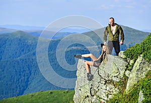 Couple hikers enjoy view. Hiking peaceful moment. Tourist hiker girl and man relaxing. Hiking benefits. Hiking weekend