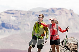Couple hikers in high mountains