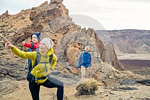 Couple hiking with baby boy travelling in backpack