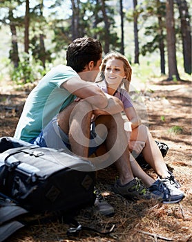 Couple, hiking break and travel in forest for outdoor fitness, adventure and wellness journey or health in nature. Happy