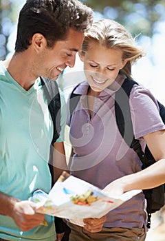 Couple, hiking in forest and lost with map, documents guide or location information for nature travel or journey. Young