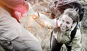 Couple Hiking Helping Climbing Mountain Concept