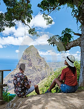 Couple hiking in Saint Lucia Caribbean, nature trail in the jungle of Saint Lucia huge Pitons