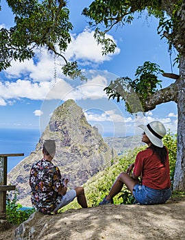 Couple hiking in Saint Lucia Caribbean, nature trail in the jungle of Saint Lucia huge Pitons