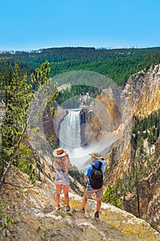 Couple on hiking trip enjoying beautiful mountain scenery.