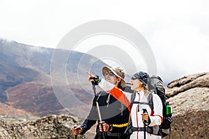 Couple hiking walking in mountains