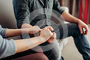 Couple hold hands, family psychology support