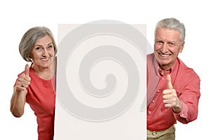 Couple holding blank banner