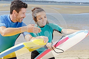 Couple holding bodyboards