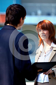 Couple Holding a Business Conversation