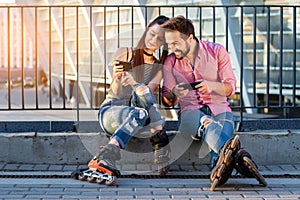 Couple holding cellphones.