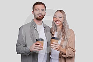 Couple Holding Coffee Cups Isolated. Couple Standing and Holding Coffee to go Cup. Man and Woman Hugging, Lovers