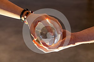 Couple holding a crystal ball together