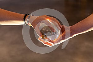 Couple holding a crystal ball together