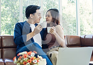 Couple is holding cups of coffee