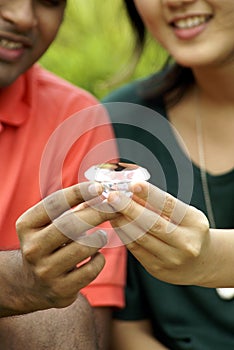 Couple holding a diamond photo