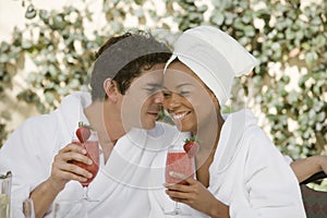 Couple Holding Glasses Of Strawberry Juice