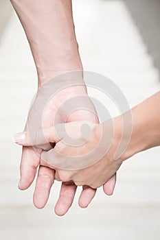 Couple holding hands