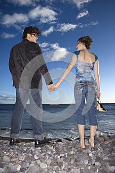 Couple Holding Hands on Beach