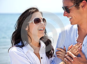 Couple holding hands beach