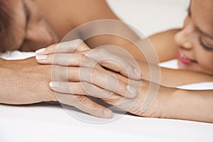 Couple Holding Hands In Bed