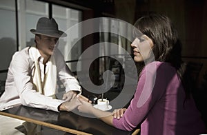 Couple Holding Hands At Cafe