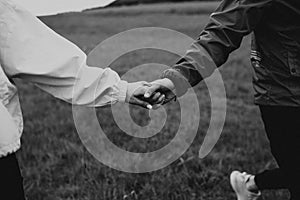 Couple holding hands. hand with engagement ring. Couple in love. Love concept.