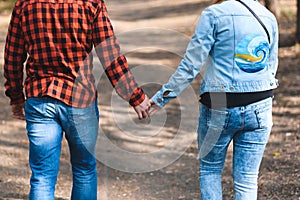 couple holding hands at park