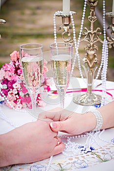 Couple holding hands at table