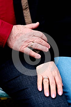 Couple holding hands in wedding rings love