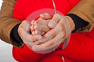 Couple holding hands on wintertime